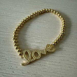 Saks Fifth Avenue Gold Beaded Bracelet with Love Charm
